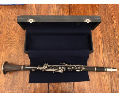 A cased mid-20thC rosewood clarinet by Cabart of Paris.