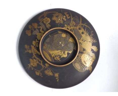 A Japanese Meiji period black lacquered shallow bowl, decorated to underside with a tiger, 14” diameter – damage to rim and g