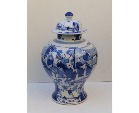 A 19thC Chinese blue &amp; white porcelain covered vase, the inverted baluster body painted with scenes including children at