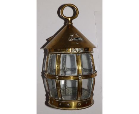 A circular brass barrel-shaped lantern with glazed base, 11” high.