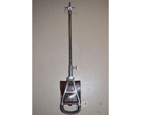 A leather and steel shooting stick.