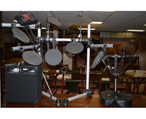 A Yamaha electric drum kit; together with a leather covered stool; and a Fender Rumble 25 amplifier.