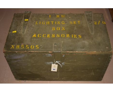 A military packing case painted green, inscribed '1kw Lighting Set', 2/6 box accessories, opening to reveal a fitted interior