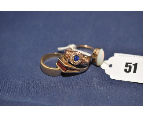 Gold rings, to include: an 18ct. yellow gold graduated band, 6grms; an opal ring; a garnet ring; and a blue and white stone r