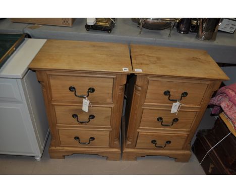 A pair of modern pine bedside chest of three drawers decorative reeded corners and bracket feet.