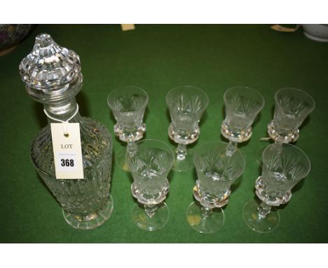 A Waterford crystal decanter; together with seven thistle pattern wine glasses.