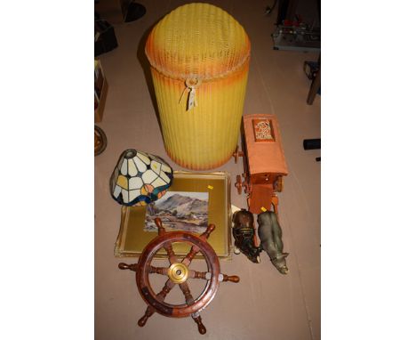 A Lloyd Loom linen basket; a print after Harry Sticks; a Tiffany style lamp shade; and a model of caravan and horses.
