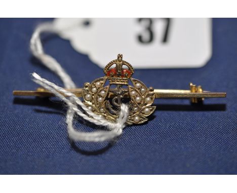 A seed pearl and enamel naval interest sweetheart brooch, on yellow metal bar stamped '9ct.', 3.2grms gross.