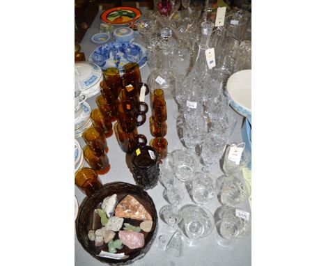 A 19th Century cut glass decanter; a later cut glass decanter; cut glass drinking glasses; amber coloured drinking glasses; a
