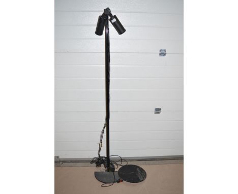 A modern floor standing lamp, by Oluce.