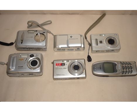 Four compact cameras by Casio; Kodak; HP; and FujiFilm; together with a Nokia mobile phone.  (6)