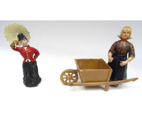 Solidcast German style Novelty Figures Huntswoman with umbrella, 70mm scale, and Dutchwoman with barrow, 85mm scale (Conditio