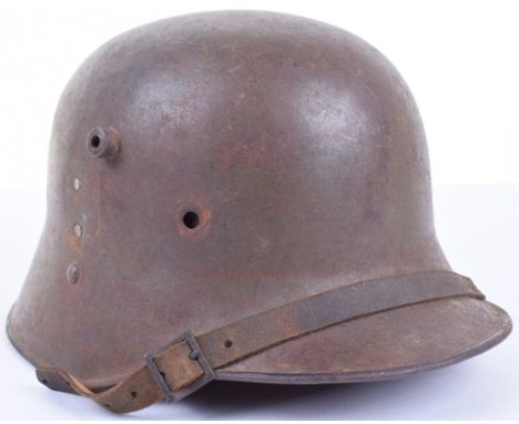 Austrian M-17 Steel Helmet, retaining approximately 40% of the original paint finish to the exterior. Later decal has once be