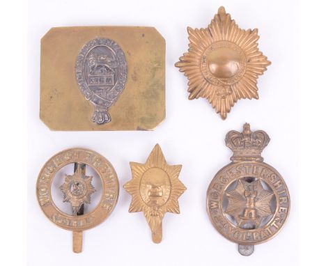 Assorted Badges of the Worcestershire Regiment, including 1st pattern helmet plate centre, belt buckle with silvered central 