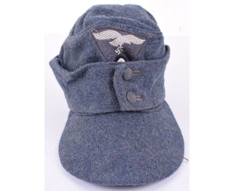 WW2 German Luftwaffe Field Divisions M-43 Field Cap, fine example in blue wool with one piece eagle and cockade insignia. Two