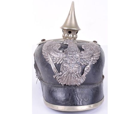 Prussian Dragoon Regiment Pickelhaube, as found example having leather shell with white metal Prussian Dragoon helmet plate t