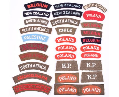 Selection of WW2 Nationality Shoulder Titles, consisting of printed and embroidered POLAND, woven POLAND, embroidered white o