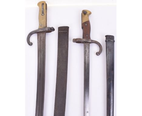 French Gras Bayonet, with wooden and brass hilt, cross guard with muzzle ring, triangular blade stamped with arsenal and 1879