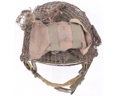 WW2 American Airborne M1C Paratroopers Combat Helmet, good example complete with much of its original combat paint finish to 