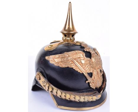 Imperial German Prussian Dragoon NCO’s Pickelhaube, model 1871 leather shell with square dip peak having brass trim. Leather 