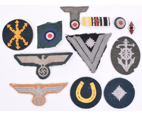 Selection of WW2 German Cloth Insignia, including embroidered Helmsman trade badge, “T” shaped German M-43 cap eagle and cock