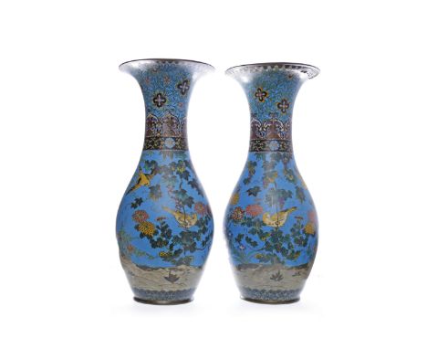 PAIR OF EARLY 20TH CENTURY CHINESE CLOISONNE ENAMEL VASESwith trumpet mouth and decorated with birds and florals on a blue gr