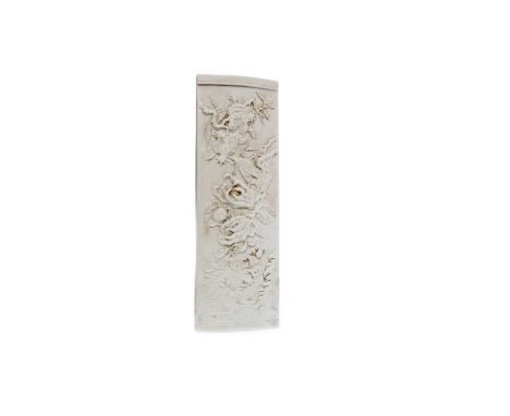 20TH CENTURY CHINESE WHITE CERAMIC WRIST RESTdecorated in relief with insects and flowering branches, impressed character mar