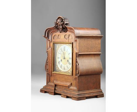 Continental oak cased mantel clock, square brass dial silvered chapter ring with black roman numerals, 42cm high, 32.5cm long