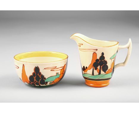 Clarice Cliff hand painted Fantasque sugar bowl and cream jug, decorated in trees and house pattern, circa 1930