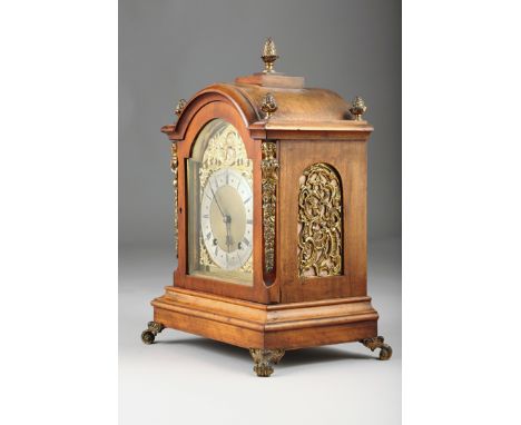 Fine mahogany bracket clock with gilt metal mounts, raised on gilt metal scroll feet, brass arched dial with silver chapter r