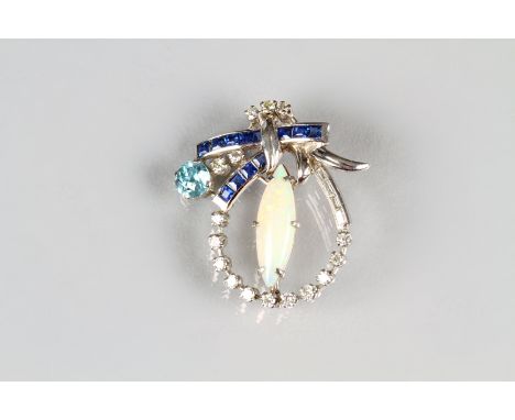 Ladies 18 carat white gold gem set brooch, a marquise shaped opal to the centre with an arch of brilliant and baguette cut di