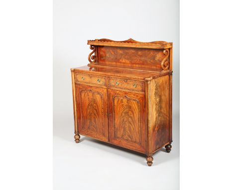 Early Victorian mahogany chiffonier, galleried top with scroll supports over twin frieze drawers above a pair of panel door c