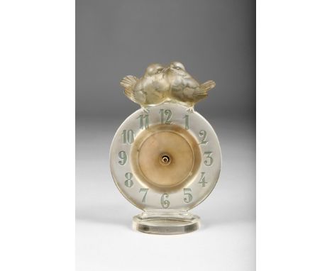 Rene Lalique glass mantel clock, moulded glass circular dial, stained blue numerals, with a pair of birds perched to the top 
