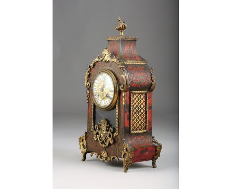 A Late 19th Century French brass inlaid red tortoiseshell and ormolu mounted mantel clock, circular gilt dial with twelve ena
