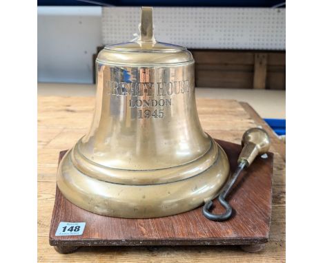 A 'WWII Trinity House Ship's Bell- 1945' together with stand and bronze striker, in bronze, height 28cm.