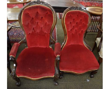 A Victorian carved mahogany framed button back gentleman's armchair, together with a similar ladies chair (2)
