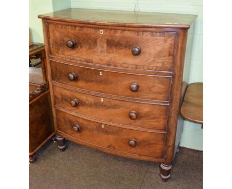 A Victorian bow fronted four-height chest of drawers