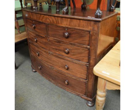 A Victorian bow fronted mahogany four-height chest of drawers