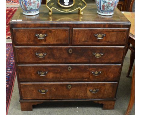 A mid-18th century walnut and crossbanded caddy top chest of drawers, two short over three long graduated drawers, bracket su