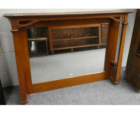 An Arts &amp; Crafts oak over mantel mirror 