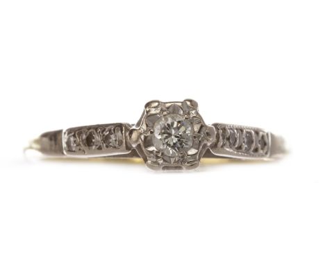 TWENTIETH CENTURY DIAMOND RING, with an illusion set round brilliant cut diamond of approximately 0.10 carats, flanked by thr