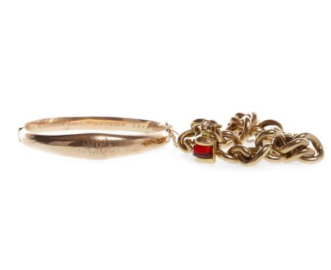 CURB LINK BRACELET, each link marked 9ct, with a red gem set charm, the heart shaped padlock marked 9ct; along with a nine ca