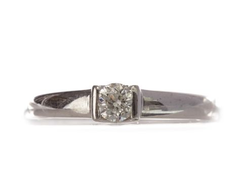 DIAMOND SOLITAIRE RING, with a tension set round brilliant cut diamond of approximately 0.20 carats, in eighteen carat white 