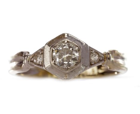 DIAMOND DRESS RING, with a round brilliant cut diamond of approximately 0.20 carats, within a hexagonal setting, flanked by t