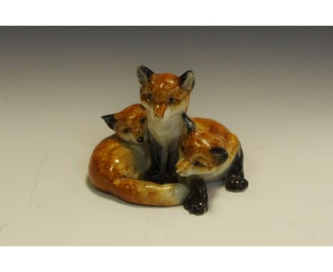 A Royal Worcester animal model,  of three fox cubs,  printed crown and circle mark in puce, model no. 3131