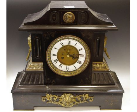 A 19th Century French marble mantel clock Roman numerals, twin winding holes flanked by masks of a young lady, hand chased gi