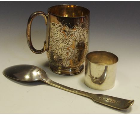 A Victorian silver fiddleback dessert spoon, hallmarked London; a silver serviette ring, hallmarked Birmingham; a silver chri