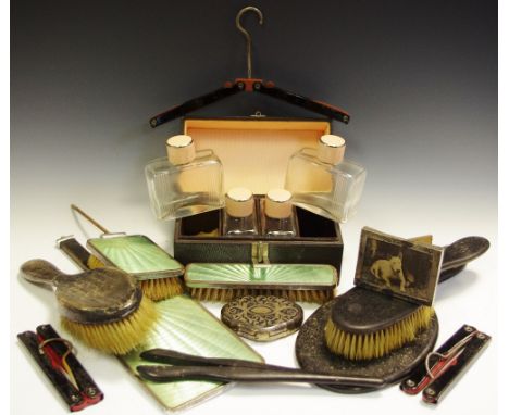 Bijouterie - a set of four Art Deco lady's rectangular travelling cosmetic bottles, each engraved with parallel lines, chrome