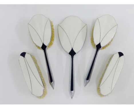 Art Deco black and white enamel on chrome dressing table brush set comprising two hair brushes, two clothes brushes and a han