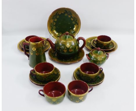 Sarreguemines green glazed pottery teaset with stylised Art Nouveau floral pattern comprising teapot, milk jug, sugar bowl, s